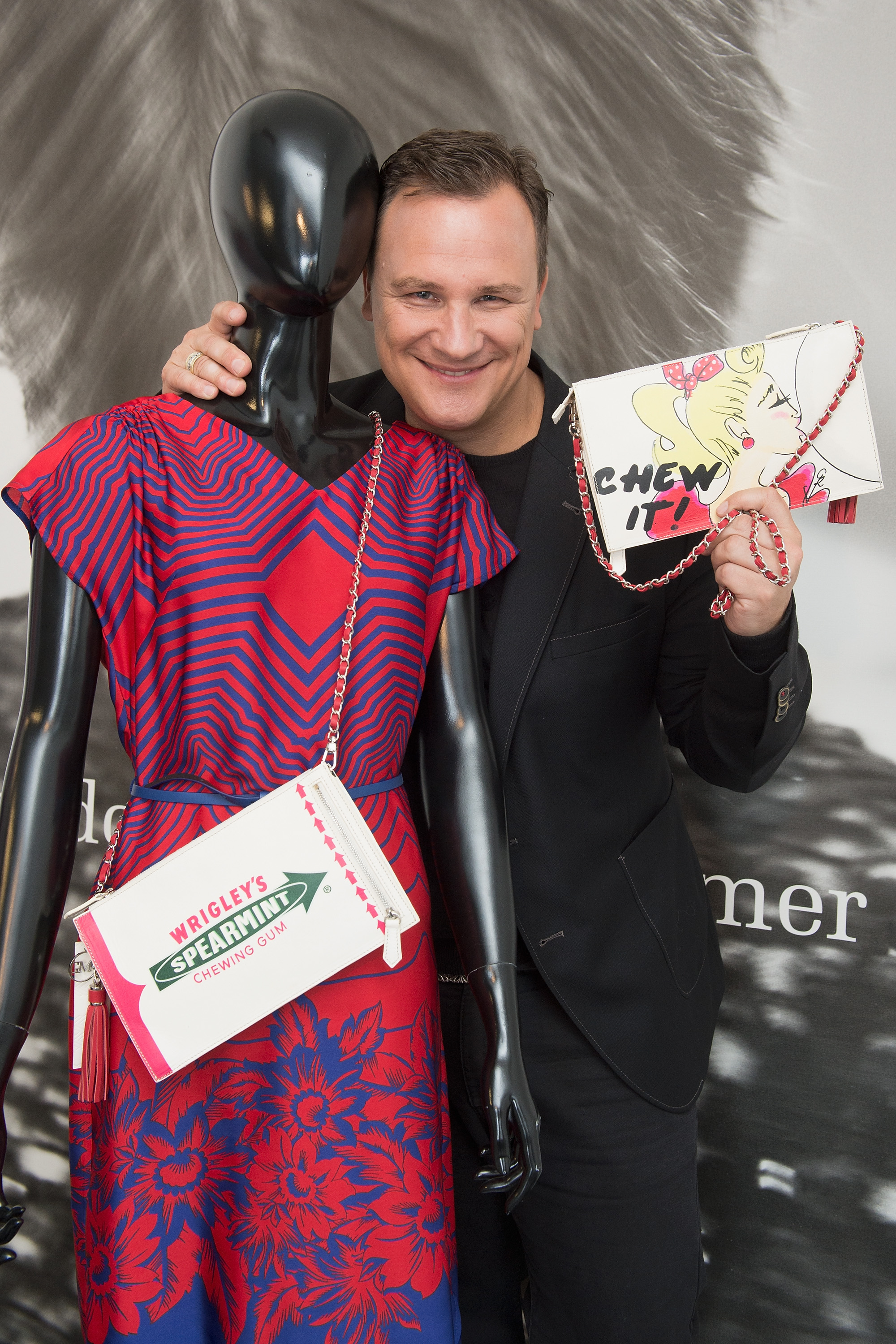 BERLIN, GERMANY - JULY 27:  Guido Maria Kretschmer poses with his newly designed clutch for Wrigley's Spearmint on July 27, 2015 in Berlin, Germany.  (Photo by Matthias Nareyek/Getty Images for Wrigley's Spearmint) *** Local Caption *** Guido Maria Kretschmer