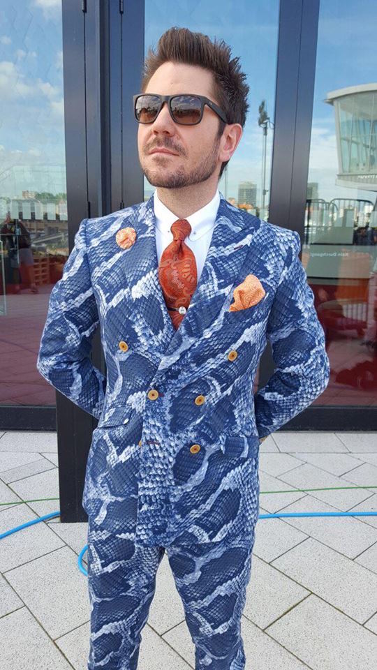 Justin Leone in a suit by Herr von Eden â in front of Tantris restaurant